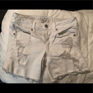 White ripped denim shorts